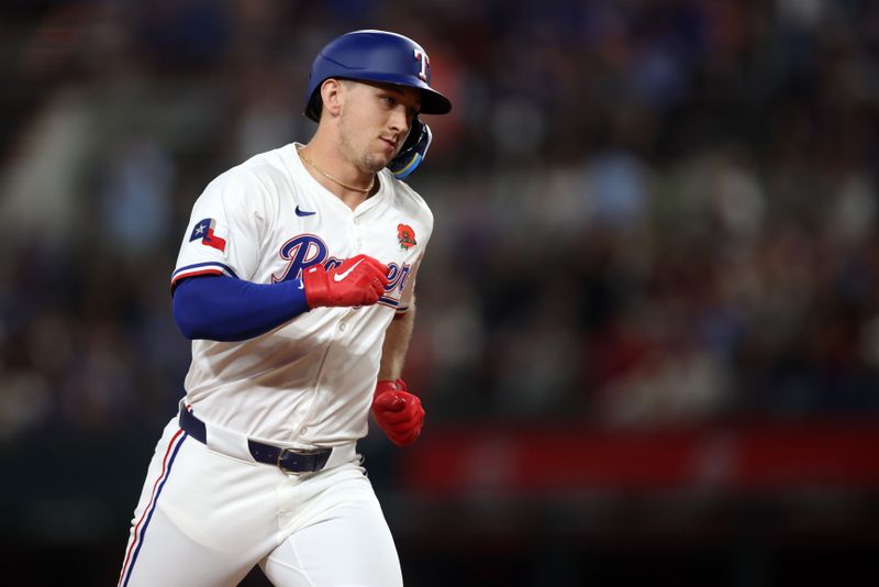 May 26, 2025; Arlington, Texas, USA; Texas Rangers outfielder Wyatt Langford (36) rounds the bases after hitting a solo home run during the fourth inning against the Toronto Blue Jays at Globe Life Field. Mandatory Credit: Tim Heitman-Imagn Images