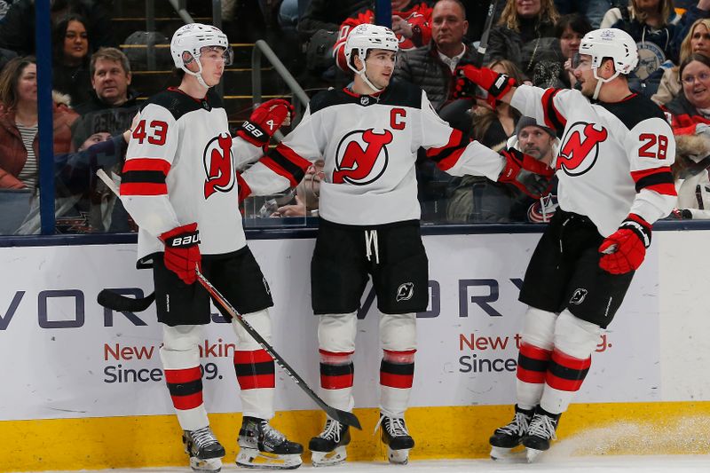 Jan 19, 2024; Columbus, Ohio, USA; New Jersey Devils center Nico Hischier (13) celebrates his goal against the Columbus Blue Jackets during the second period at Nationwide Arena. Mandatory Credit: Russell LaBounty-USA TODAY Sports