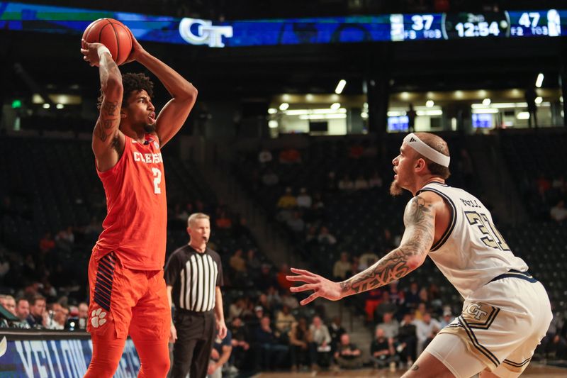 Jan 14, 2025; Atlanta, Georgia, USA; Georgia Tech Yellow Jackets forward Duncan Powell (31) plays defense against Clemson Tigers guard Dillon Hunter (2) during the second half at McCamish Pavilion. Mandatory Credit: Jordan Godfree-Imagn Images