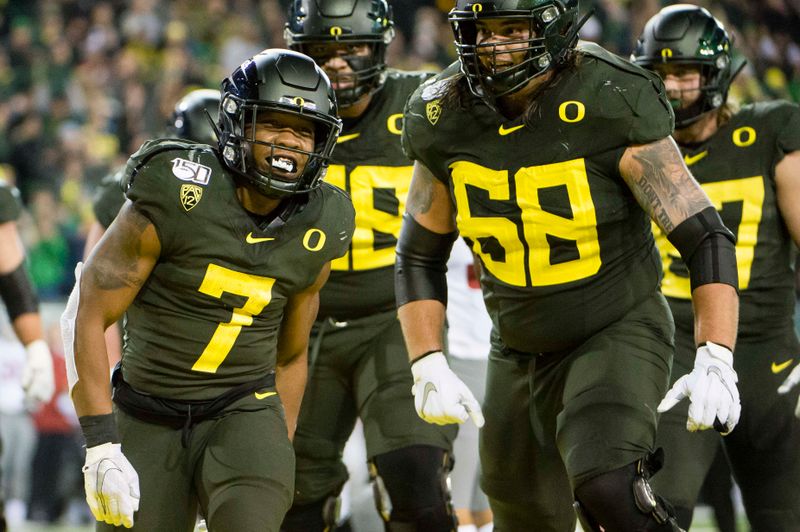 Oct 26, 2019; Eugene, OR, USA; Oregon Ducks running back CJ Verdell (7) celebrates with teammates after scoring a touchdown during the second half against the Washington State Cougars at Autzen Stadium. Mandatory Credit: Troy Wayrynen-USA TODAY Sports