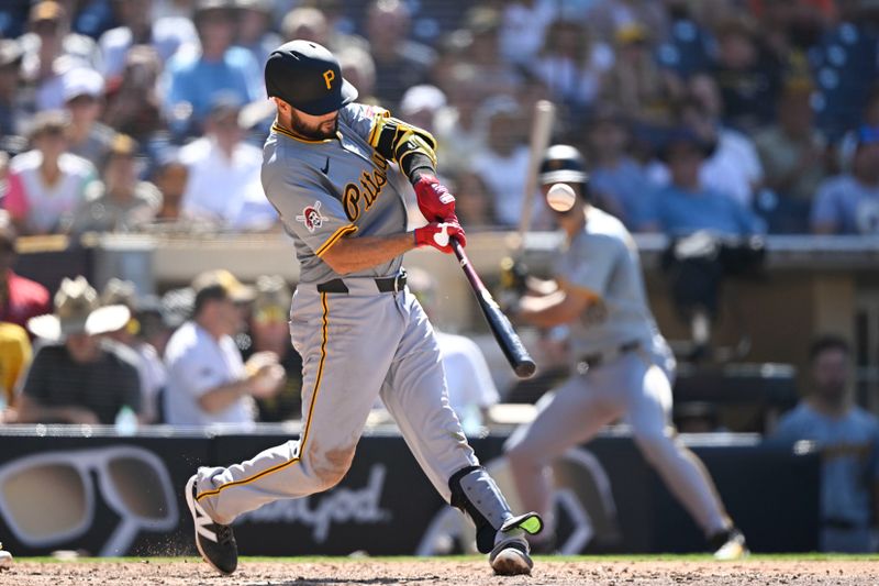 August 14, 2024; San Diego, California, USA; Pittsburgh Pirates third baseman Isiah Kiner-Falefa (7) hits an RBI single against the San Diego Padres during the ninth inning at Petco Park. Mandatory Credit: Denis Poroy-USA TODAY Sports at Petco Park. 