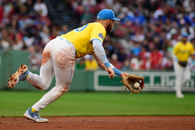 Jun 28, 2025; Boston, Massachusetts, USA; Boston Red Sox shortstop Trevor Story (10) fields a ground ball during the seventh inning against the Toronto Blue Jays at Fenway Park. Mandatory Credit: Bob DeChiara-Imagn Images