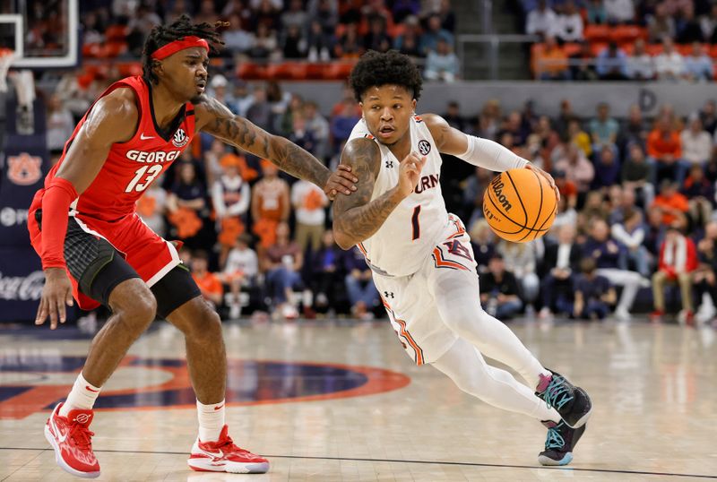 Feb 1, 2023; Auburn, Alabama, USA;  Auburn Tigers guard Wendell Green Jr. (1) moves for shot as Georgia Bulldogs guard Mardrez McBride (13) defends during the second half at Neville Arena. Mandatory Credit: John Reed-USA TODAY Sports