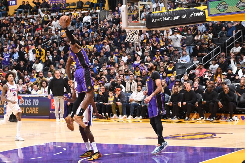 LOS ANGELES, CA - MARCH 22: LeBron James #23 of the Los Angeles Lakers dunks the ball during the game against the Philadelphia 76ers on March 22, 2024 at Crypto.Com Arena in Los Angeles, California. NOTE TO USER: User expressly acknowledges and agrees that, by downloading and/or using this Photograph, user is consenting to the terms and conditions of the Getty Images License Agreement. Mandatory Copyright Notice: Copyright 2024 NBAE (Photo by Adam Pantozzi/NBAE via Getty Images)