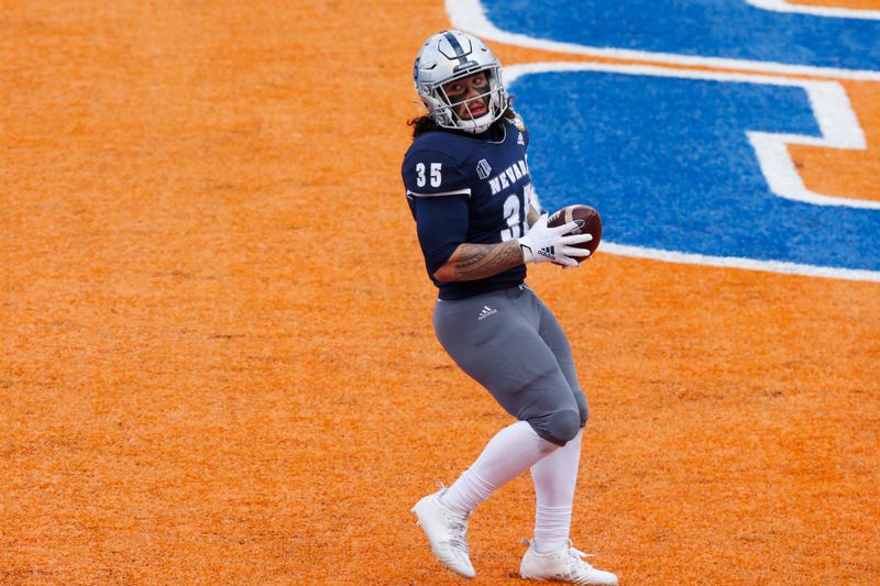 Dec 22, 2020; Boise, Idaho, USA; Nevada Wolf Pack running back Toa Taua (35) looks back after scoring a touchdown during the first half of the Famous Idaho Potato Bowl versus the Tulane Green Wave  at Albertsons Stadium. Mandatory Credit: Brian Losness-USA TODAY Sports

