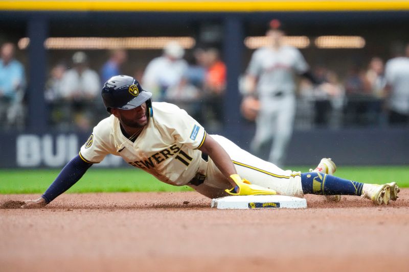 Aug 27, 2024; Milwaukee, Wisconsin, USA;  Milwaukee Brewers right fielder Jackson Chourio (11) steals second base during the first inning against the San Francisco Giants at American Family Field. Mandatory Credit: Jeff Hanisch-USA TODAY Sports