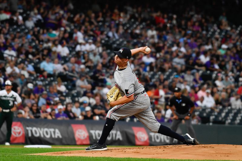 Sep 30, 2023; Denver, Colorado, USA; Minnesota Twins relief pitcher Emilio Pagan (15) delivers a pitch in the first inning against the Colorado Rockies at Coors Field. Mandatory Credit: John Leyba-USA TODAY Sports