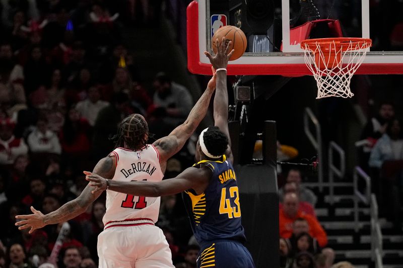 CHICAGO, ILLINOIS - MARCH 27: Pascal Siakam #43 of the Indiana Pacers fouls DeMar DeRozan #11 of the Chicago Bulls during the second half at the United Center on March 27, 2024 in Chicago, Illinois. NOTE TO USER: User expressly acknowledges and agrees that, by downloading and or using this photograph, User is consenting to the terms and conditions of the Getty Images License Agreement. (Photo by Patrick McDermott/Getty Images)