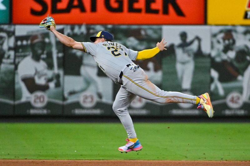 Aug 20, 2024; St. Louis, Missouri, USA;  Milwaukee Brewers shortstop Willy Adames (27) leaps and catches a line drive against the St. Louis Cardinals during the seventh inning at Busch Stadium. Mandatory Credit: Jeff Curry-USA TODAY Sports