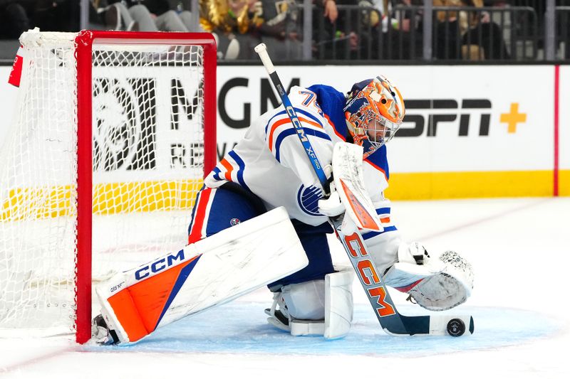 Feb 6, 2024; Las Vegas, Nevada, USA; Edmonton Oilers goaltender Stuart Skinner (74) stops a Vegas Golden Knights shot during the third period at T-Mobile Arena. Mandatory Credit: Stephen R. Sylvanie-USA TODAY Sports