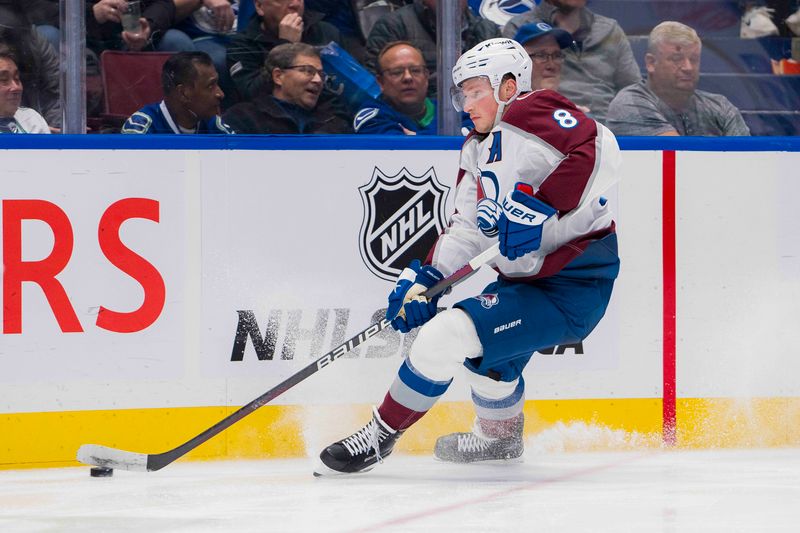 Mar 13, 2024; Vancouver, British Columbia, CAN; Colorado Avalanche defenseman Cale Makar (8) handles the puck against the Vancouver Canucks in the third period at Rogers Arena. Colorado won 4 -3 in overtime. Mandatory Credit: Bob Frid-USA TODAY Sports