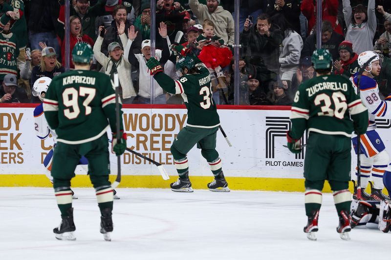 Dec 20, 2025; Saint Paul, Minnesota, USA; Minnesota Wild right wing Ryan Hartman (38) celebrates his goal against the Edmonton Oilers during the first period at Grand Casino Arena. Mandatory Credit: Matt Krohn-Imagn Images