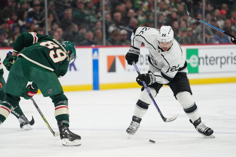 Feb 21, 2023; Saint Paul, Minnesota, USA; Los Angeles Kings left wing Kevin Fiala (22) brings the puck into the Minnesota Wild zone, defended by center Frederick Gaudreau (89) in the first period at Xcel Energy Center. Mandatory Credit: Matt Blewett-USA TODAY Sports