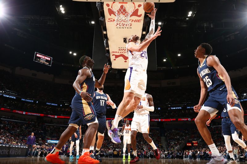 NEW ORLEANS, LA - DECEMBER 11: Dario Saric #20 of the Phoenix Suns drives to the basket during the game against the New Orleans Pelicans on December 11, 2022 at the Smoothie King Center in New Orleans, Louisiana. NOTE TO USER: User expressly acknowledges and agrees that, by downloading and or using this Photograph, user is consenting to the terms and conditions of the Getty Images License Agreement. Mandatory Copyright Notice: Copyright 2022 NBAE (Photo by Ned Dishman/NBAE via Getty Images)