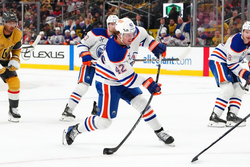 Apr 1, 2025; Las Vegas, Nevada, USA; Edmonton Oilers right wing Kasperi Kapanen (42) shoots against the Vegas Golden Knights during the first period at T-Mobile Arena. Mandatory Credit: Stephen R. Sylvanie-Imagn Images