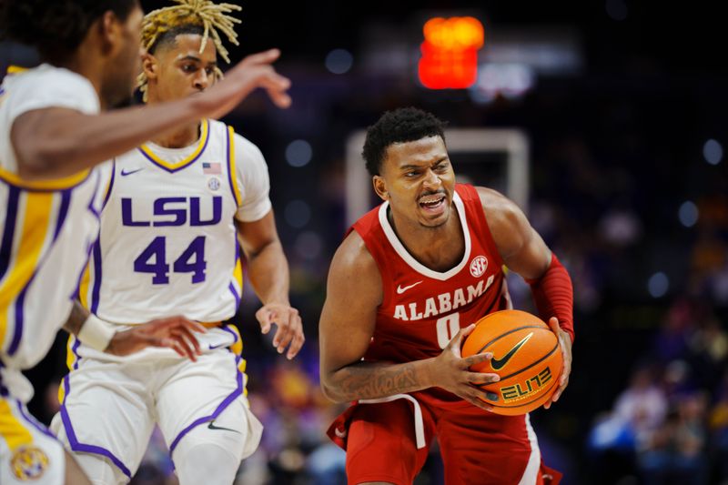 Feb 4, 2023; Baton Rouge, Louisiana, USA; Alabama Crimson Tide guard Jaden Bradley (0) fights for position against LSU Tigers guard Adam Miller (44) during the second half at Pete Maravich Assembly Center. Mandatory Credit: Andrew Wevers-USA TODAY Sports