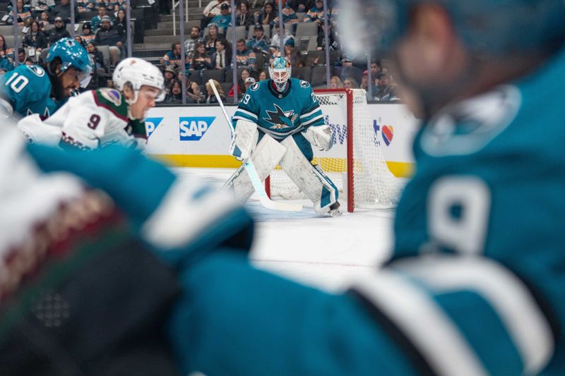 Dec 21, 2023; San Jose, California, USA; San Jose Sharks goaltender Mackenzie Blackwood (29) watches the puck during the first period against the Arizona Coyotes at SAP Center at San Jose. Mandatory Credit: Stan Szeto-USA TODAY Sports