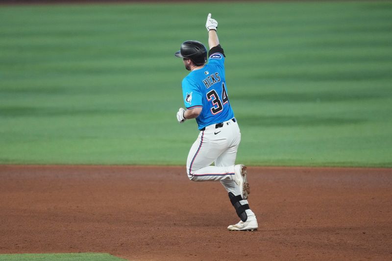 May 18, 2025; Miami, Florida, USA;  Miami Marlins catcher Liam Hicks (34) rounds the bases after hitting a two-run home run in the sixth inning against the Tampa Bay Rays at loanDepot Park. Mandatory Credit: Jim Rassol-Imagn Images