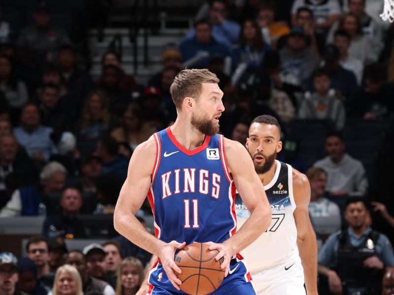 MINNEAPOLIS, MN -  NOVEMBER 27: Domantas Sabonis #11 of the Sacramento Kings handles the ball during the game against the Minnesota Timberwolves on November 27, 2024 at Target Center in Minneapolis, Minnesota. NOTE TO USER: User expressly acknowledges and agrees that, by downloading and or using this Photograph, user is consenting to the terms and conditions of the Getty Images License Agreement. Mandatory Copyright Notice: Copyright 2024 NBAE (Photo by David Sherman/NBAE via Getty Images)