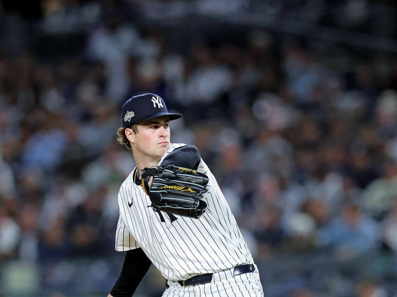Oct 8, 2025; Bronx, New York, USA; New York Yankees pitcher Cam Schlittler (31) pitches during the third inning against the Toronto Blue Jays during game four of the ALDS round for the 2025 MLB playoffs at Yankee Stadium. Mandatory Credit: Brad Penner-Imagn Images