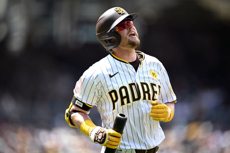 May 1, 2024; San Diego, California, USA; San Diego Padres first baseman Jake Cronenworth (9) reacts after flying out during the third inning against the Cincinnati Reds at Petco Park. Mandatory Credit: Orlando Ramirez-USA TODAY Sports