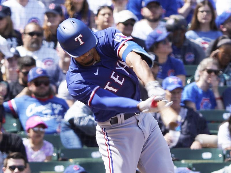 Apr 9, 2023; Chicago, Illinois, USA; Texas Rangers center fielder Bubba Thompson (8) hits a one run double against the Chicago Cubs during the second inning at Wrigley Field. Mandatory Credit: David Banks-USA TODAY Sports