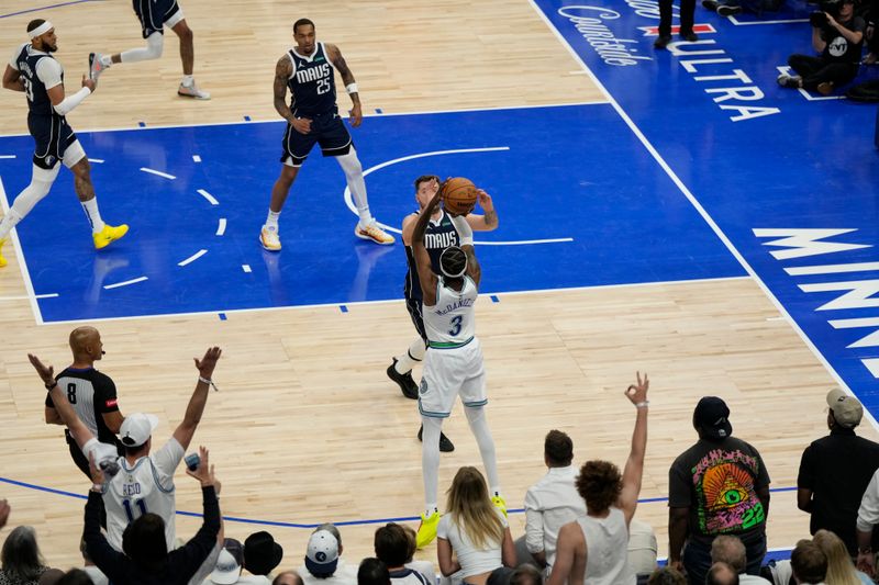 MINNEAPOLIS, MN -  MAY 22: Jaden McDaniels #3 of the Minnesota Timberwolves shoots a three point basket during the game  against the Dallas Mavericks during Game 1 of the Western Conference Finals of the 2024 NBA Playoffs on January 1, 2024 at Target Center in Minneapolis, Minnesota. NOTE TO USER: User expressly acknowledges and agrees that, by downloading and or using this Photograph, user is consenting to the terms and conditions of the Getty Images License Agreement. Mandatory Copyright Notice: Copyright 2024 NBAE (Photo by Jordan Johnson/NBAE via Getty Images)