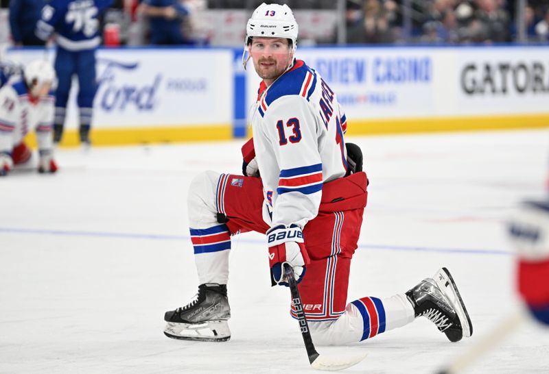 Mar 2, 2024; Toronto, Ontario, CAN;  New York Rangers forward Alexis Lafreniere (13) warms up before playing the Toronto Maple Leafs at Scotiabank Arena. Mandatory Credit: Dan Hamilton-USA TODAY Sports