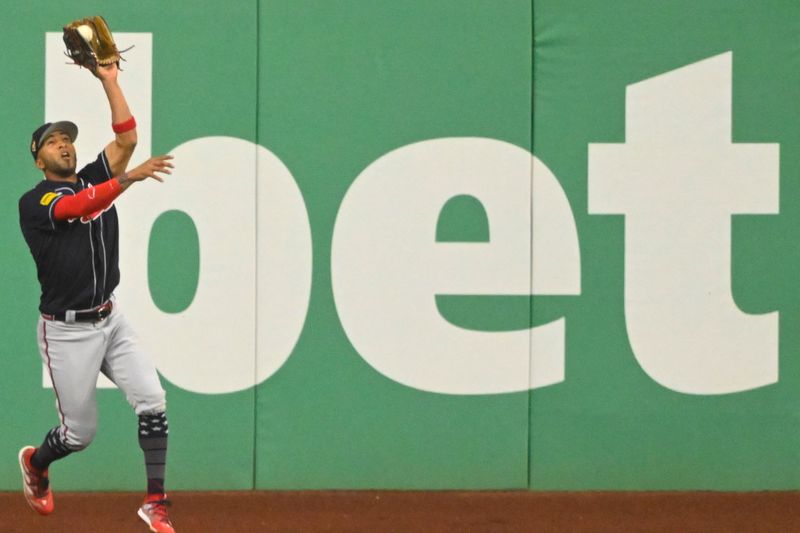 Jul 4, 2023; Cleveland, Ohio, USA; Atlanta Braves left fielder Eddie Rosario (8) makes a catch in the seventh inning against the Cleveland Guardians at Progressive Field. Mandatory Credit: David Richard-USA TODAY Sports