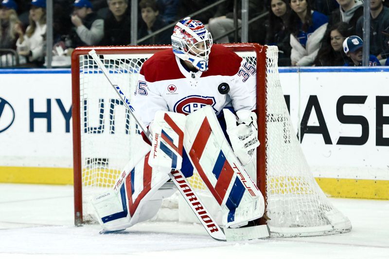 Nov 30, 2024; New York, New York, USA; Montreal Canadiens goaltender Sam Montembeault (35) makes a save against the New York Rangers during the first period at Madison Square Garden. Mandatory Credit: John Jones-Imagn Images