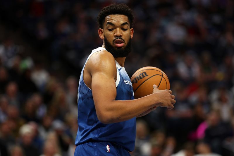 MINNEAPOLIS, MINNESOTA - APRIL 12: Karl-Anthony Towns #32 of the Minnesota Timberwolves looks on against the Atlanta Hawks in the first quarter at Target Center on April 12, 2024 in Minneapolis, Minnesota. NOTE TO USER: User expressly acknowledges and agrees that, by downloading and or using this photograph, User is consenting to the terms and conditions of the Getty Images License Agreement. (Photo by David Berding/Getty Images)