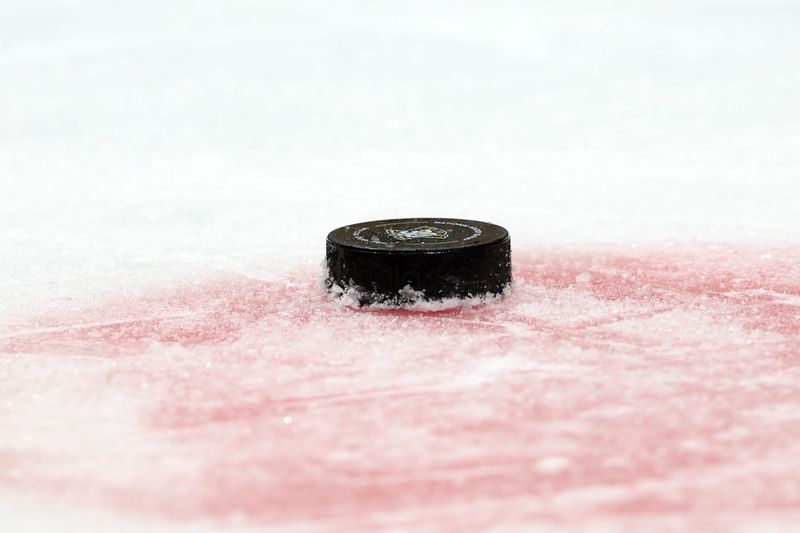 Dec 21, 2023; Anaheim, California, USA;  An official game puck on the ice during the NHL game between the Anaheim Ducks and the Calgary Flames at Honda Center. Mandatory Credit: Kiyoshi Mio-USA TODAY Sports