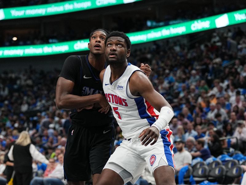 DALLAS, TX - APRIL 12: Chimezie Metu #5 of the Detroit Pistons boxes out against Olivier Maxence-Prosper #18 of the Dallas Mavericks during the game on April 12, 2024 at the American Airlines Center in Dallas, Texas. NOTE TO USER: User expressly acknowledges and agrees that, by downloading and or using this photograph, User is consenting to the terms and conditions of the Getty Images License Agreement. Mandatory Copyright Notice: Copyright 2024 NBAE (Photo by Glenn James/NBAE via Getty Images)