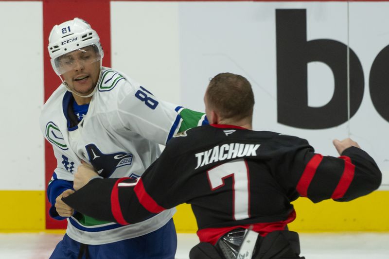 Nov 23, 2024; Ottawa, Ontario, CAN; Vancouver Canucks center Dakota Joshua (81) fights with Ottawa Senators left wing Brady Tkachuk (7) in the third period at the Canadian Tire Centre. Mandatory Credit: Marc DesRosiers-Imagn Images