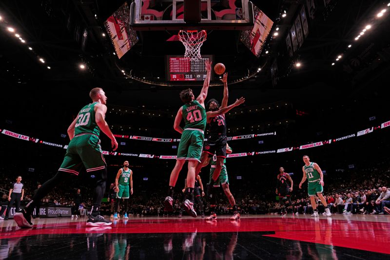 TORONTO, CANADA - JANUARY 15: Thaddeus Young #21 of the Toronto Raptors drives to the basket during the game against the Boston Celtics  on January 15, 2024 at the Scotiabank Arena in Toronto, Ontario, Canada.  NOTE TO USER: User expressly acknowledges and agrees that, by downloading and or using this Photograph, user is consenting to the terms and conditions of the Getty Images License Agreement.  Mandatory Copyright Notice: Copyright 2024 NBAE (Photo by Mark Blinch/NBAE via Getty Images)