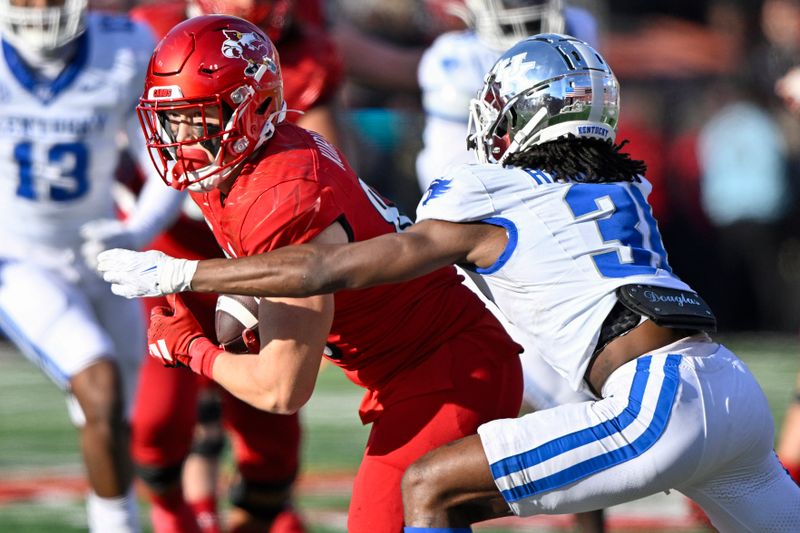 Nov 25, 2023; Louisville, Kentucky, USA; Louisville Cardinals tight end Nate Kurisky (85) runs the ball against Kentucky Wildcats defensive back Maxwell Hairston (31) during the second half at L&N Federal Credit Union Stadium. Kentucky defeated Louisville 38-31. Mandatory Credit: Jamie Rhodes-USA TODAY Sports