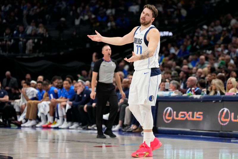 DALLAS, TEXAS - JANUARY 09: Luka Doncic #77 of the Dallas Mavericks reacts after Jaden Hardy (not pictured) #1 can't catch a pass during the second half against the Memphis Grizzlies at American Airlines Center on January 09, 2024 in Dallas, Texas. NOTE TO USER: User expressly acknowledges and agrees that, by downloading and or using this photograph, User is consenting to the terms and conditions of the Getty Images License Agreement. (Photo by Sam Hodde/Getty Images)