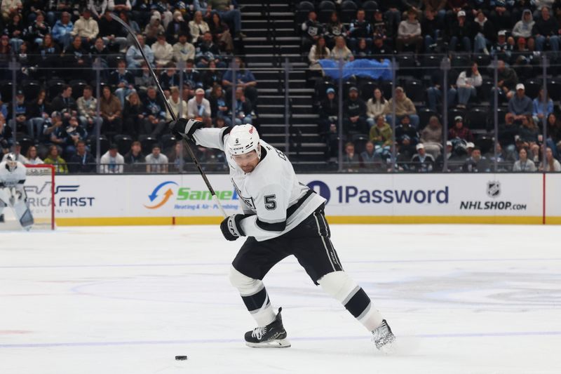Mar 22, 2026; Salt Lake City, Utah, USA; Los Angeles Kings defenseman Cody Ceci (5) prepares to shoot against the Utah Mammoth during the second period at Delta Center. Mandatory Credit: Rob Gray-Imagn Images