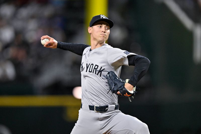 Sep 2, 2024; Arlington, Texas, USA; New York Yankees relief pitcher Luke Weaver (30) pitches against the Texas Rangers during the seventh inning at Globe Life Field. Mandatory Credit: Jerome Miron-USA TODAY Sports