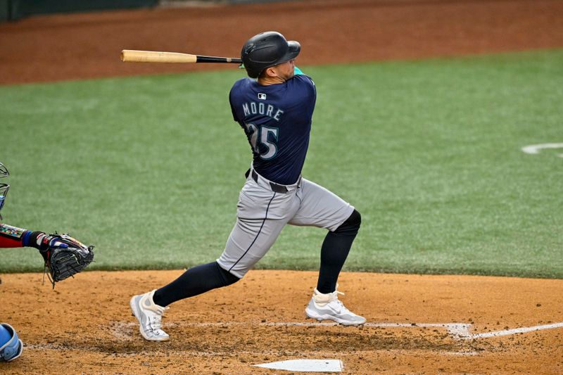 Sep 22, 2024; Arlington, Texas, USA; Seattle Mariners third baseman Dylan Moore (25) hits a double against the Texas Rangers during the sixth inning at Globe Life Field. Mandatory Credit: Jerome Miron-Imagn Images