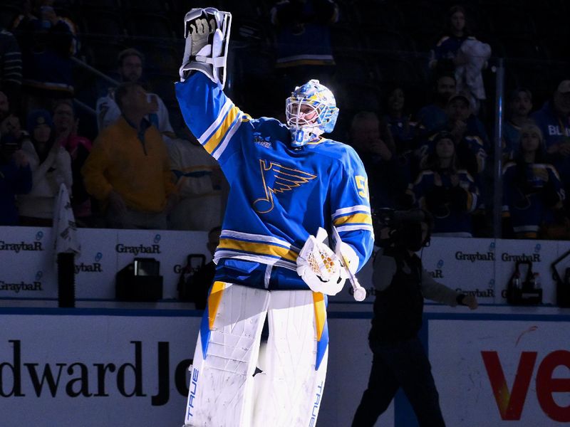 Nov 11, 2025; St. Louis, Missouri, USA; St. Louis Blues goaltender Jordan Binnington (50) salutes the fans after he was named first star of the game in a victory over the Calgary Flames at Enterprise Center. Mandatory Credit: Jeff Curry-Imagn Images