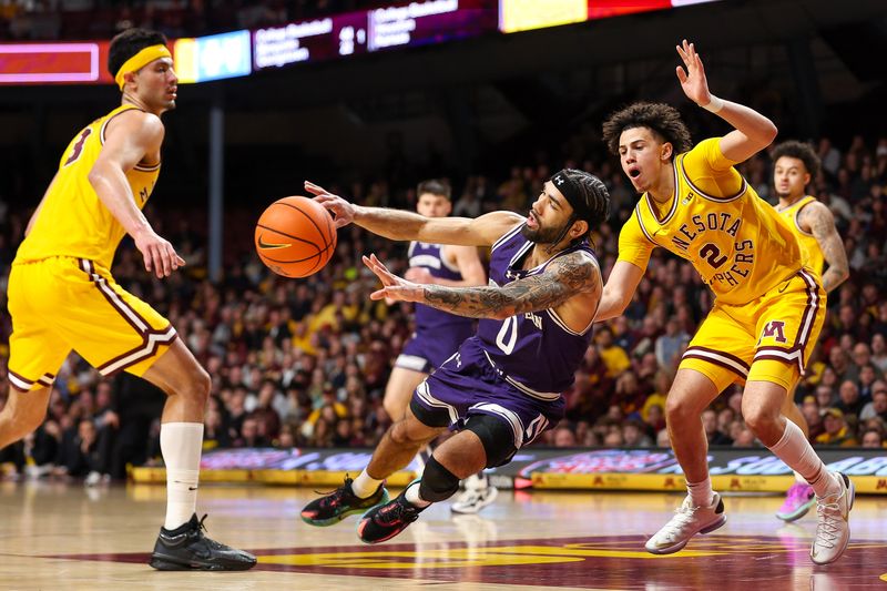 Feb 3, 2024; Minneapolis, Minnesota, USA; Northwestern Wildcats guard Boo Buie (0) passes as Minnesota Golden Gophers guard Mike Mitchell Jr. (2) defends during the second half at Williams Arena. Mandatory Credit: Matt Krohn-USA TODAY Sports