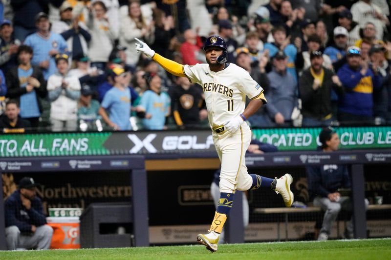 Apr 6, 2024; Milwaukee, Wisconsin, USA;  Milwaukee Brewers right fielder Jackson Chourio (11) celebrates after hitting a home run during the eighth inning against the Seattle Mariners at American Family Field. Mandatory Credit: Jeff Hanisch-USA TODAY Sports