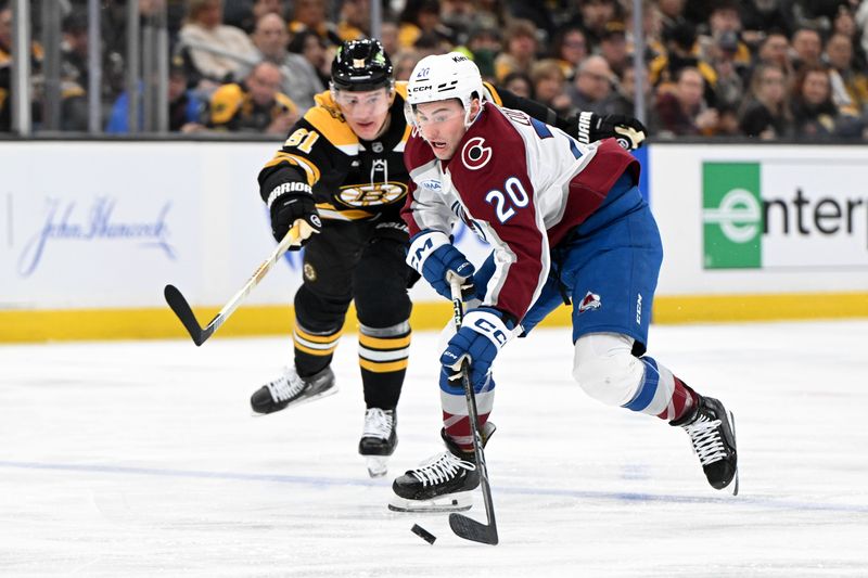 Jan 25, 2025; Boston, Massachusetts, USA; Colorado Avalanche center Ross Colton (20) skates with the puck against the Boston Bruins during the second period at the TD Garden. Mandatory Credit: Brian Fluharty-Imagn Images