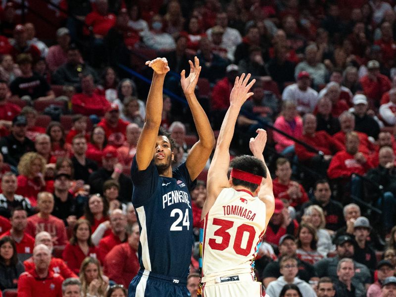 Feb 17, 2024; Lincoln, Nebraska, USA; Penn State Nittany Lions forward Zach Hicks (24) shoots a 3-point shot against Nebraska Cornhuskers guard Keisei Tominaga (30) during the second half at Pinnacle Bank Arena. Mandatory Credit: Dylan Widger-USA TODAY Sports