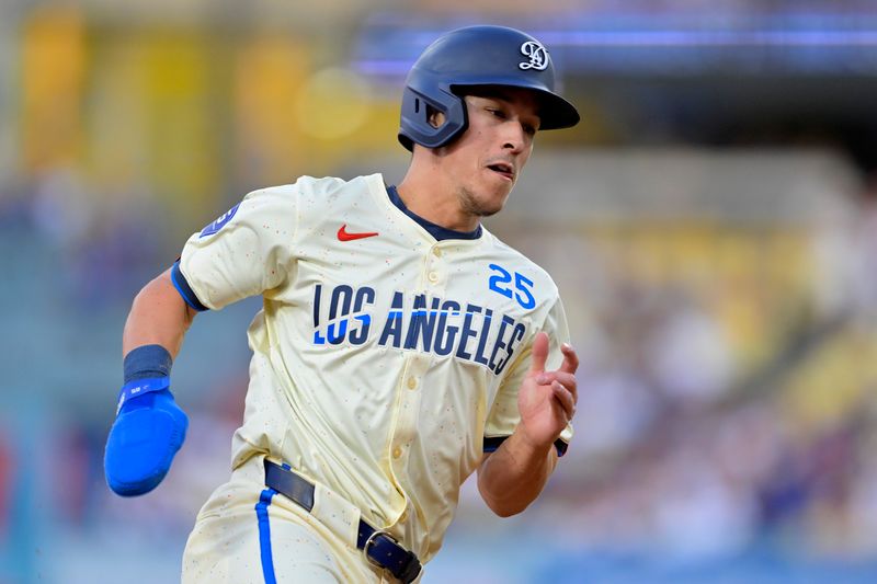 Sep 7, 2024; Los Angeles, California, USA;  Los Angeles Dodgers shortstop Tommy Edman (25) rounds third to score a run in the first inning against the Cleveland Guardians at Dodger Stadium. Mandatory Credit: Jayne Kamin-Oncea-Imagn Images