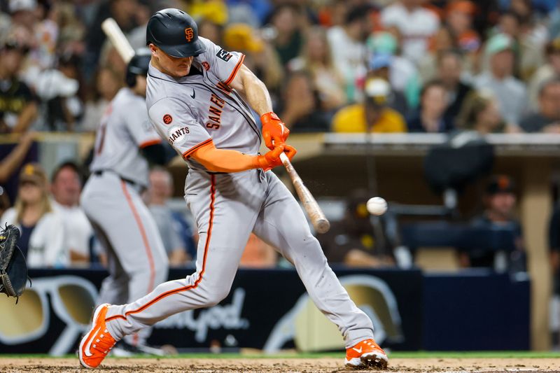 Sep 6, 2024; San Diego, California, USA; San Francisco Giants third basemen Matt Chapman (26) hits a single during the fourth inning against the San Diego Padres at Petco Park. Mandatory Credit: David Frerker-Imagn Images