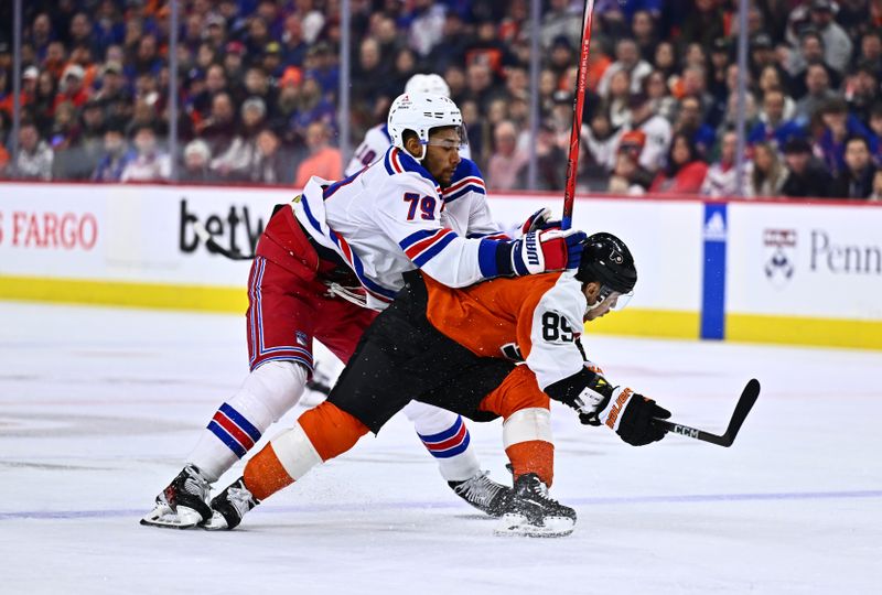 Feb 24, 2024; Philadelphia, Pennsylvania, USA; New York Rangers defenseman K'Andre Miller (79) hits Philadelphia Flyers right wing Cam Atkinson (89) in the first period at Wells Fargo Center. Mandatory Credit: Kyle Ross-USA TODAY Sports