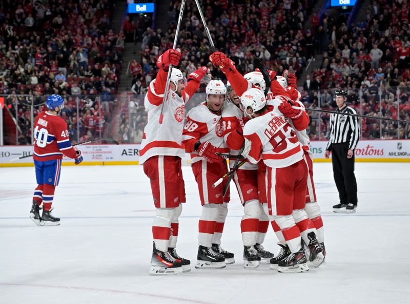 Apr 16, 2024; Montreal, Quebec, CAN; Detroit Red Wings forward David Perron (57) celebrates with teammates after scoring a goal against the Montreal Canadiens during the third period at the Bell Centre. Mandatory Credit: Eric Bolte-USA TODAY Sports