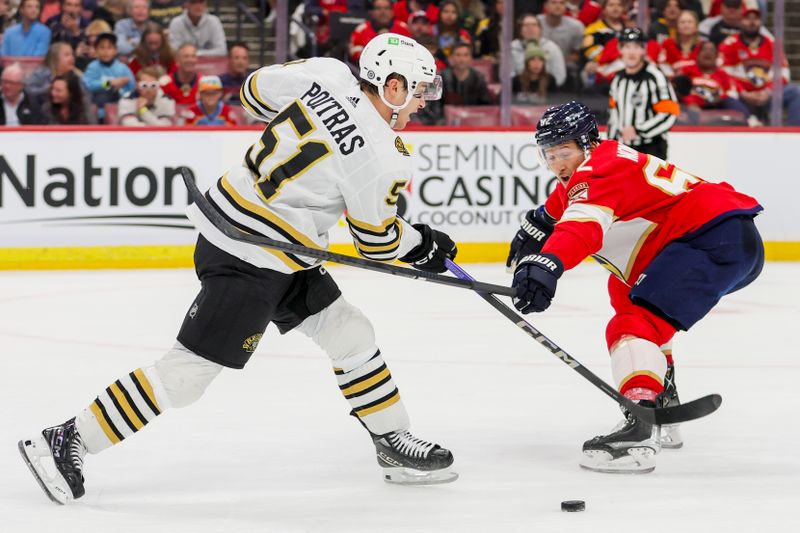 Nov 22, 2023; Sunrise, Florida, USA; Boston Bruins center Matthew Poitras (51) moves the puck against Florida Panthers defenseman Brandon Montour (62) during the first period at Amerant Bank Arena. Mandatory Credit: Sam Navarro-USA TODAY Sports